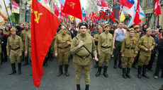 Participants in a march commemorating the liberation of Odessa from Nazi rule re-enacting the moment when Soviet soldiers stormed the Opera House. Only 18 soldiers who liberated the city survived. Dozens of young men dressed in Soviet army uniforms reconstructed the retreat of the German troops in the city 70 years before on April 10, 2014. 
